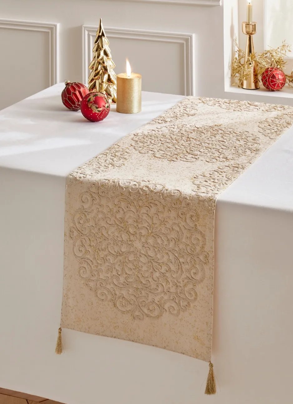 CHEMIN DE TABLE BRODÉ AVEC POMPONS DORÉS ECRU